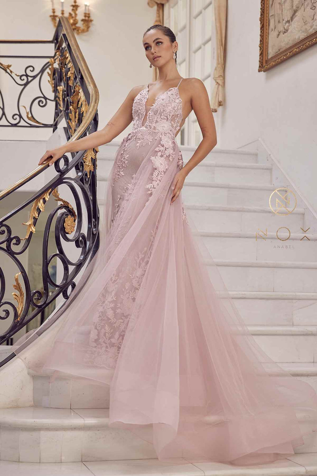 Blush mermaid lace gown with beaded applique and sheer tulle overskirt, full length