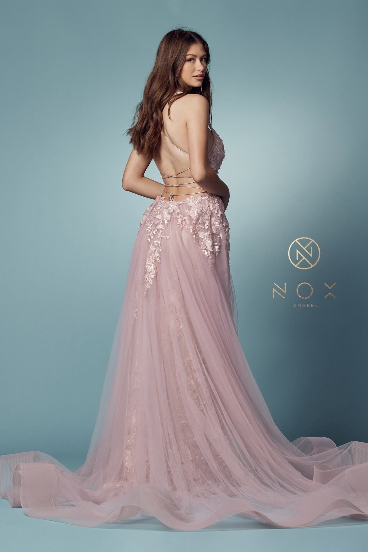 Blush mermaid lace gown with beaded bodice and sheer tulle overskirt, back side view