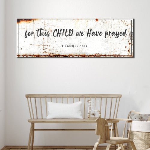 Nursery wall canvas sign above a white crib, text "1 Samuel 1:27"