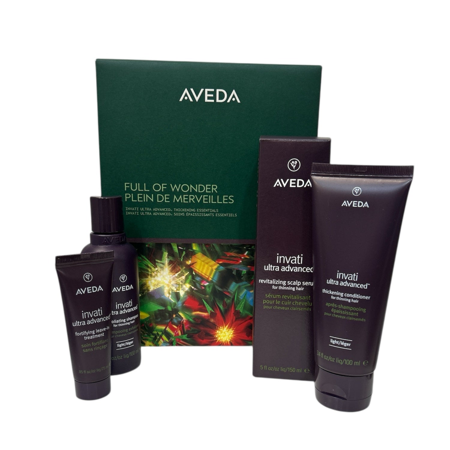 Aveda Invati thickening essentials gift set with bottles and tubes beside green box