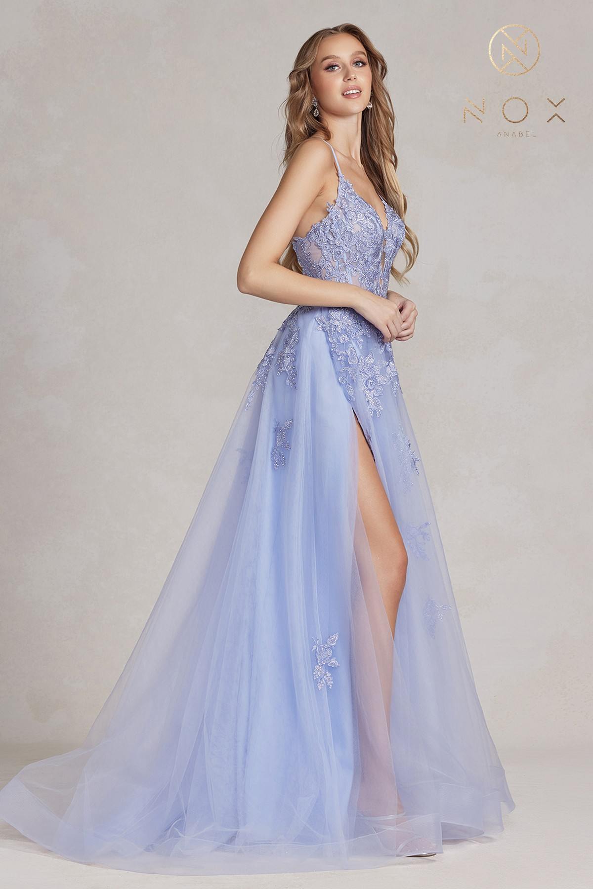 Periwinkle A-line tulle gown with lace appliques, spaghetti straps, front slit