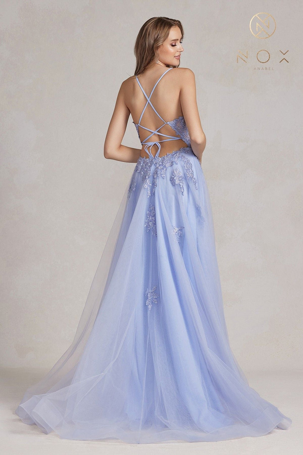 Periwinkle A-line tulle gown with lace appliques, crisscross open back, front slit