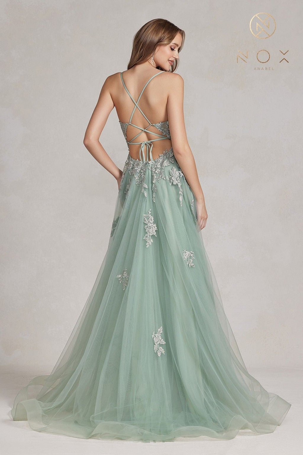 Sage green A-line tulle gown with lace appliques, crisscross open back, front slit