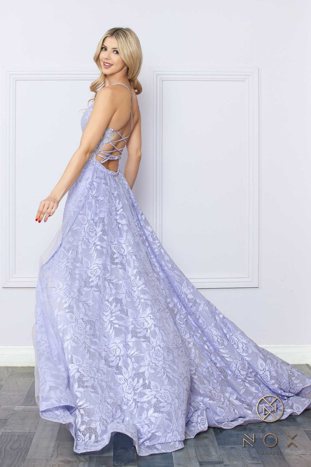 Light lavender embroidered mermaid gown with crisscross open back, lace overlay, flared skirt