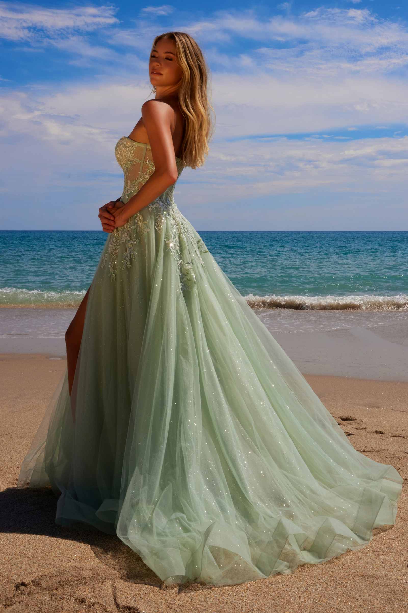 Sage green A-line tulle gown, side view, with sparkling sweetheart sequin top