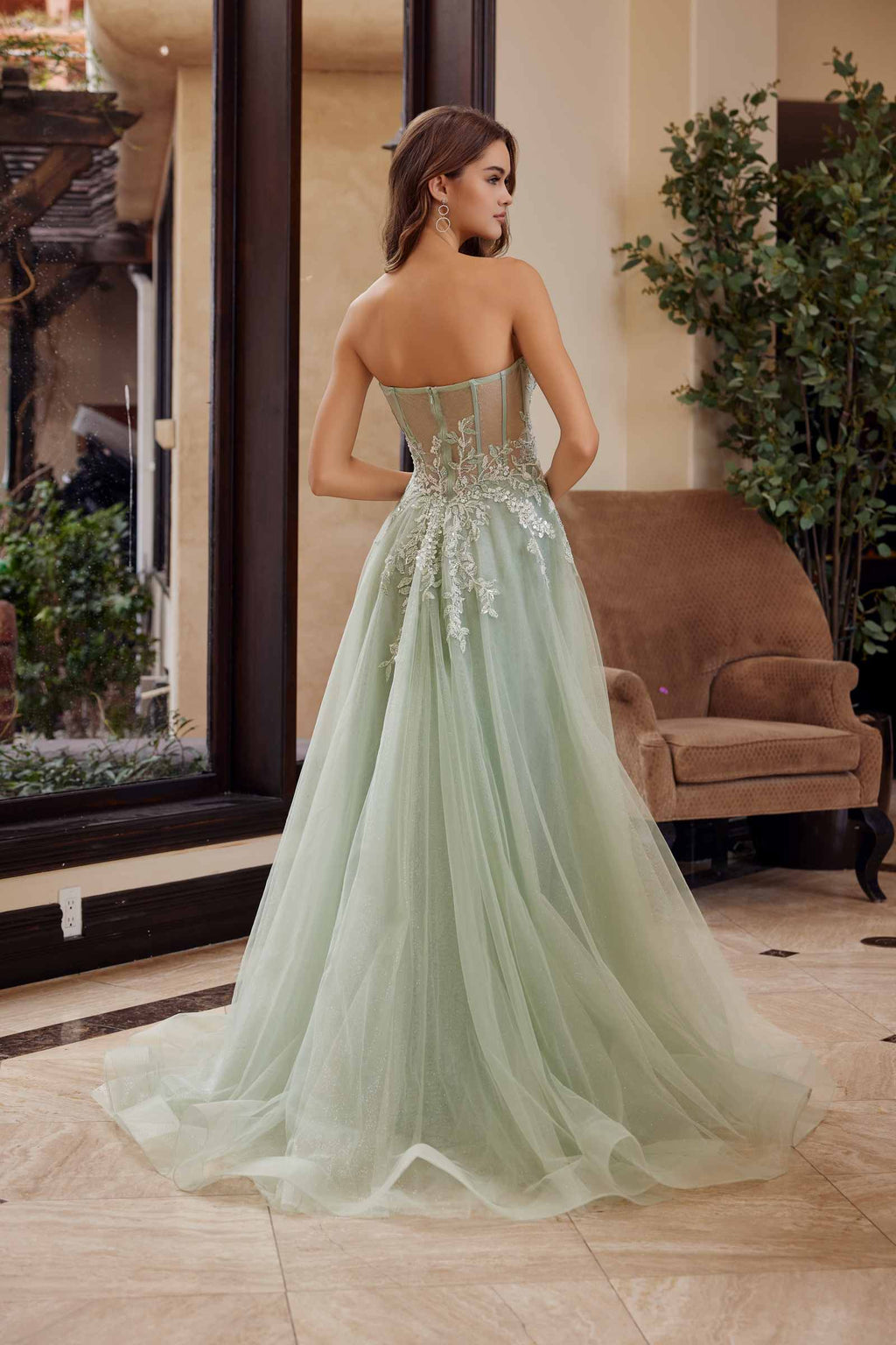 Sage green long tulle dress with sweetheart bodice, sequin detailing, and open side slit