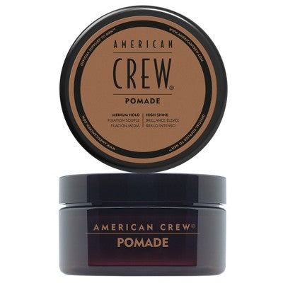 American Crew hair pomade jar with circular brown lid label on dark container