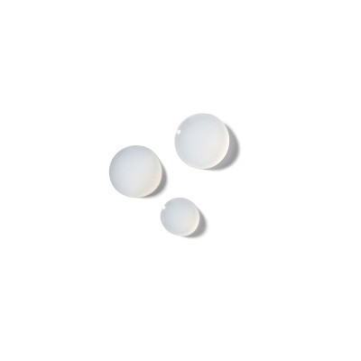 White plastic bottle caps, three pieces
