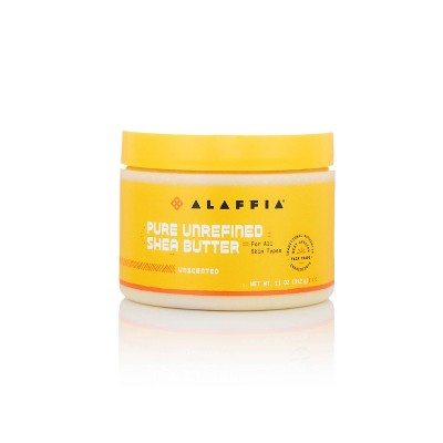 Alaffia pure unrefined shea butter jar with yellow lid, unscented front label