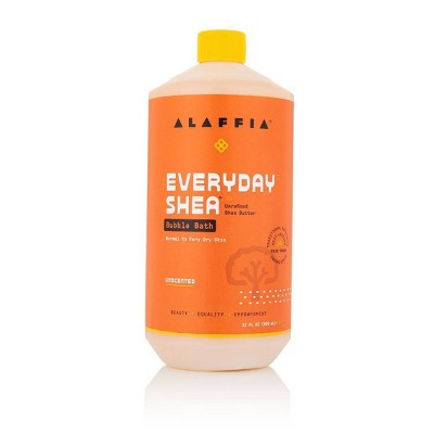 Alaffia bubble bath bottle, orange with yellow cap and Everyday Shea label.
