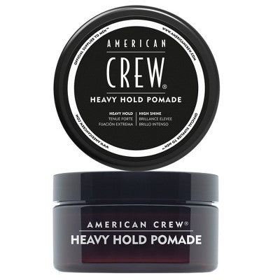 Black pomade jar with American Crew heavy hold label and round lid, 3 oz size