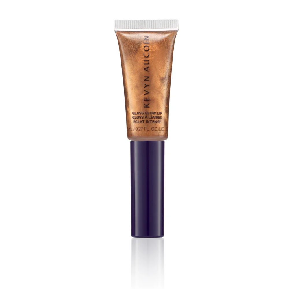 Bronze-gold lip gloss tube with purple base and silver cap