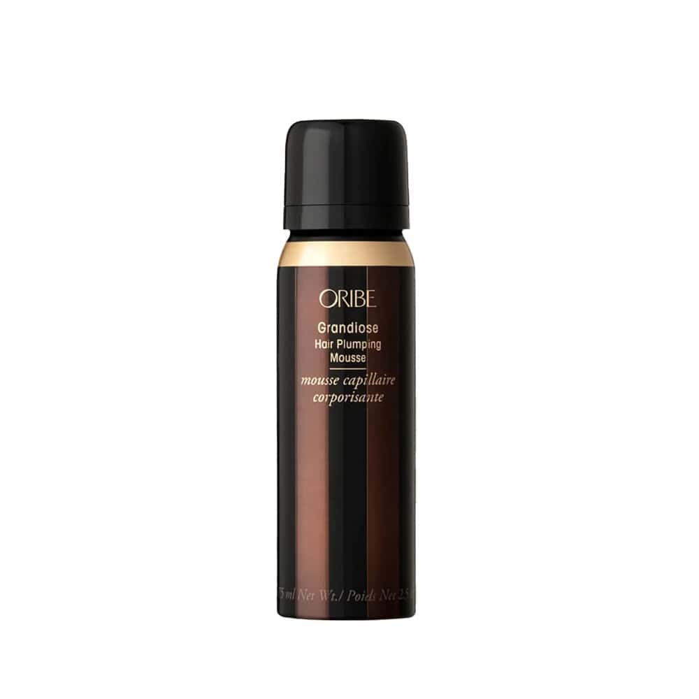 Oribe Grandiose hair plumping mousse bottle, black cap, front label close-up