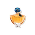 Guerlain Shalimar eau de parfum bottle with amber liquid and blue faceted cap