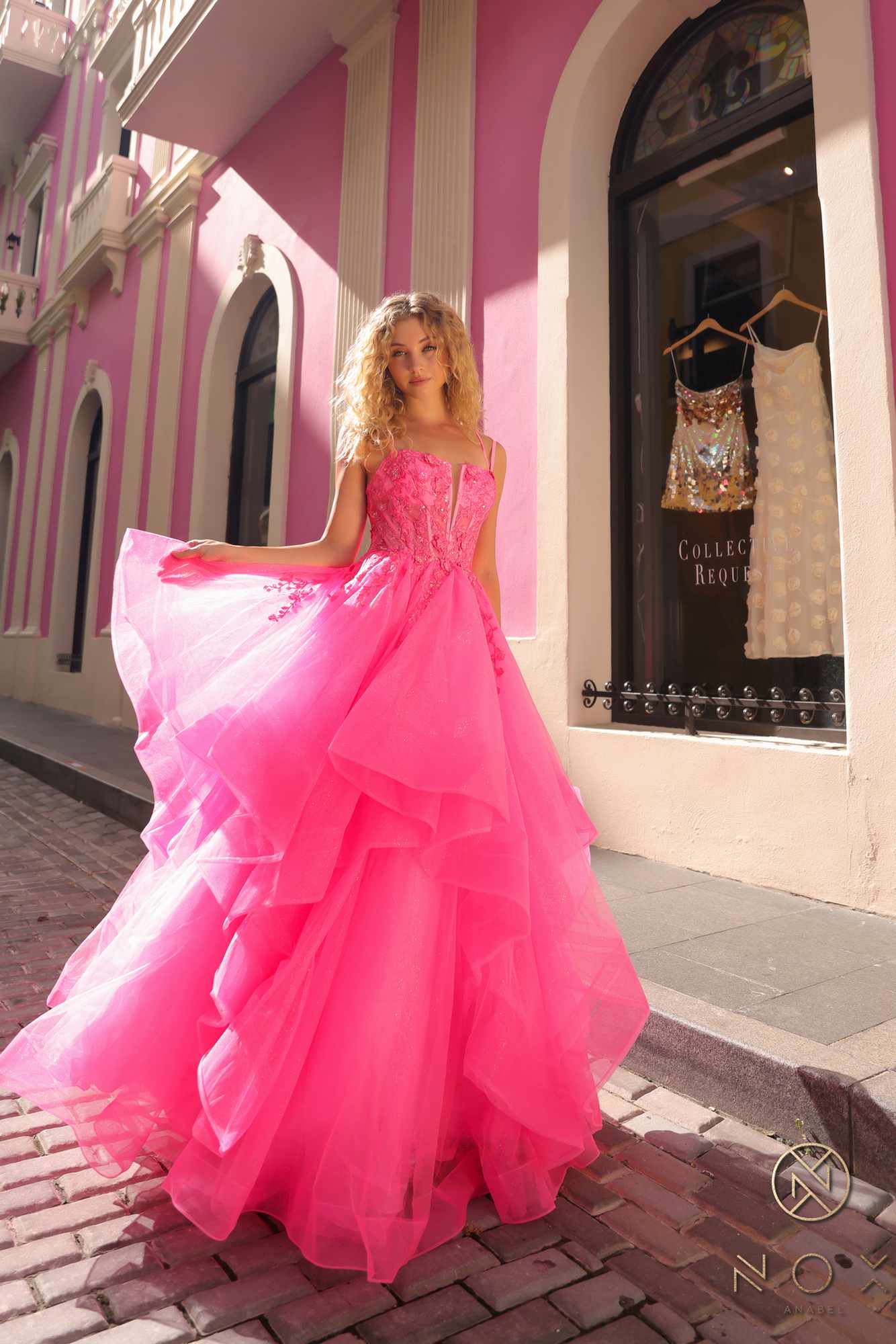 Pink tulle ballgown with layered tiered ruffles and wide A-line skirt