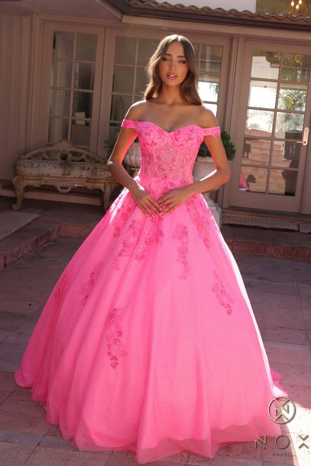 Hot pink off-shoulder ballgown with lace embroidery on fitted bodice and flared tulle skirt