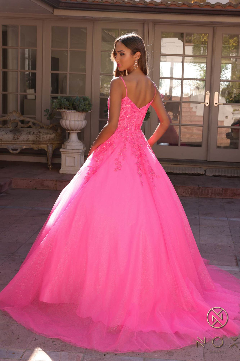 Hot pink square-neck A-line quinceanera gown with lace bodice and layered tulle skirt