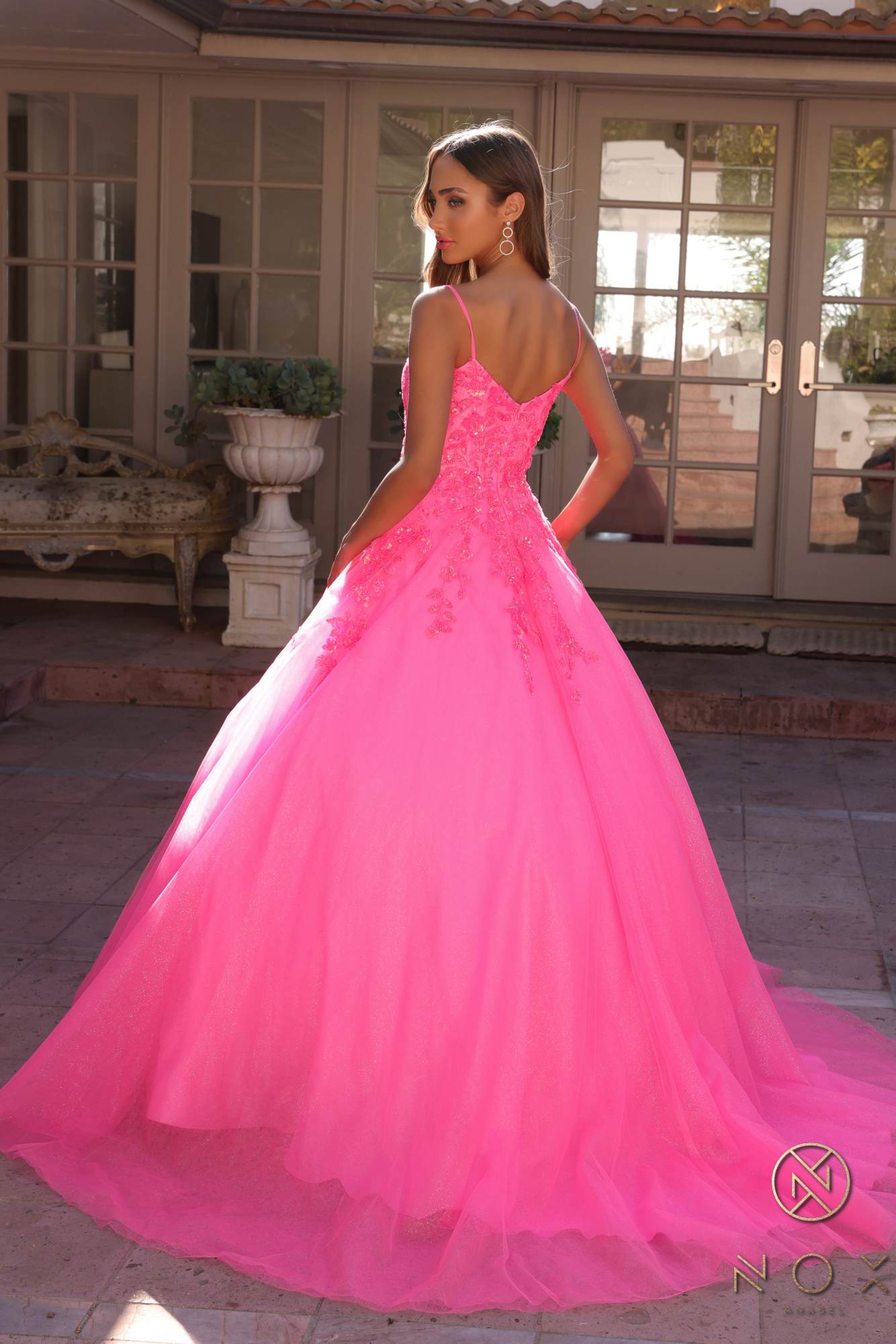 Hot pink square-neck A-line quinceanera gown with lace bodice and layered tulle skirt