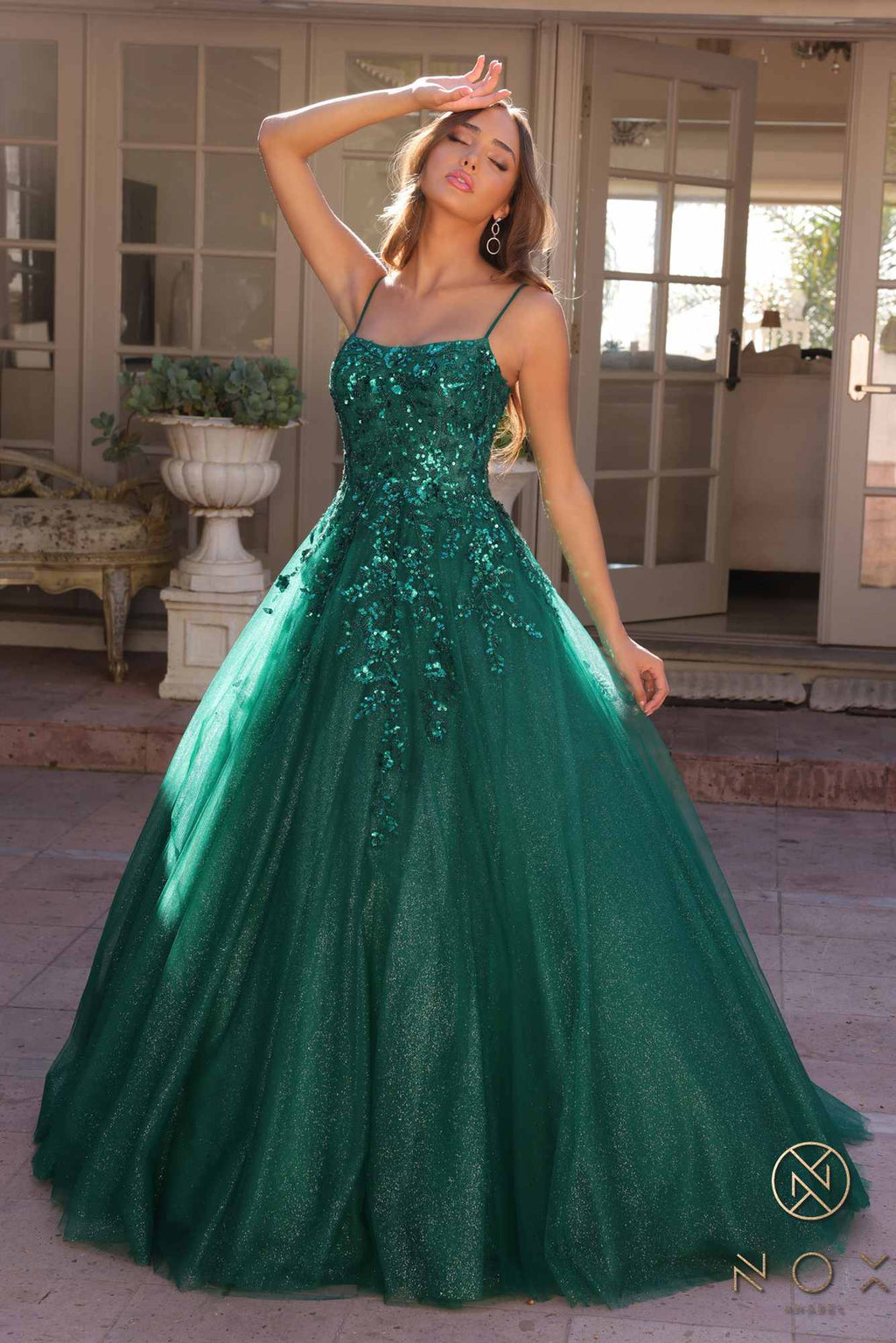 Hunter green spaghetti-strap A-line quinceanera gown with jeweled bodice and full tulle skirt