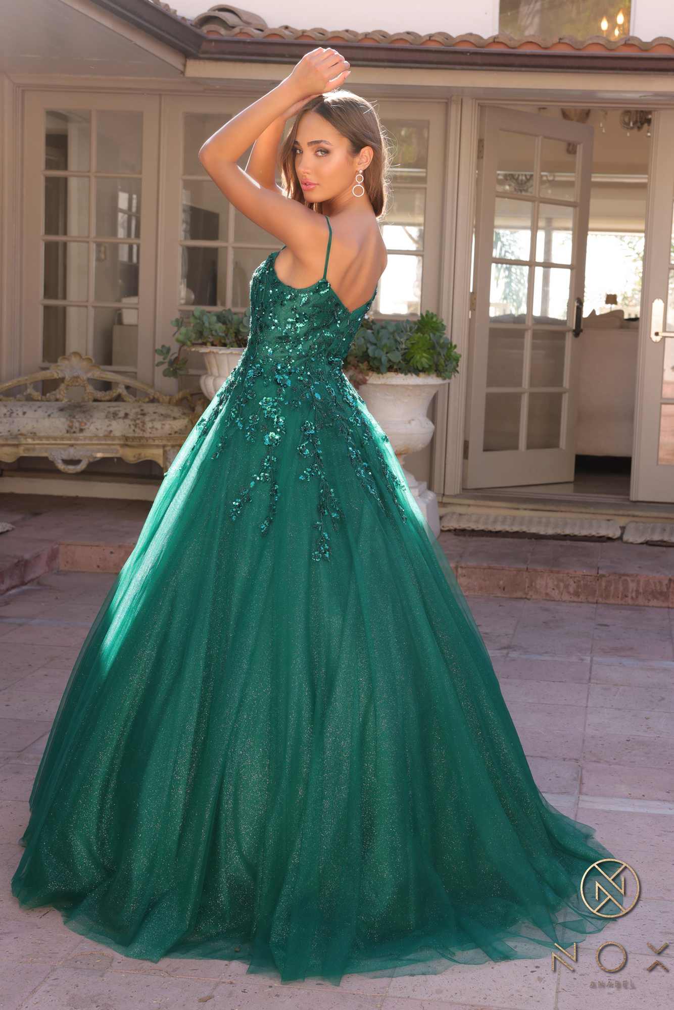 Hunter green A-line quinceanera gown with sparkling bodice and voluminous tulle skirt