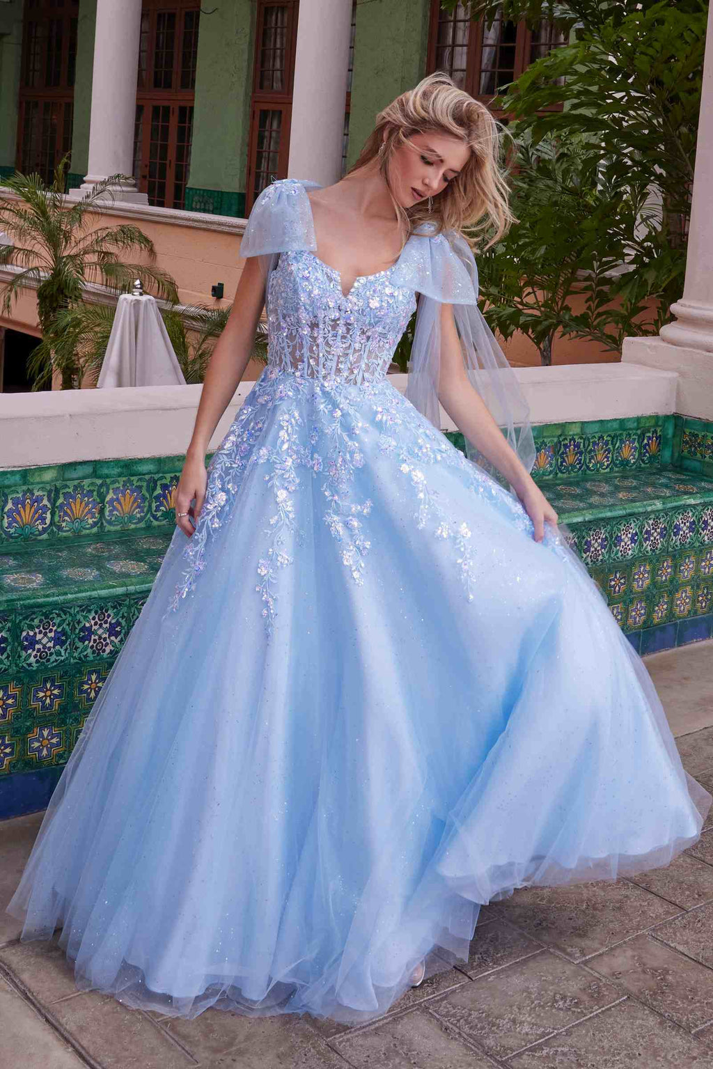 Light blue tulle ballgown dress with sequined bodice and layered full skirt