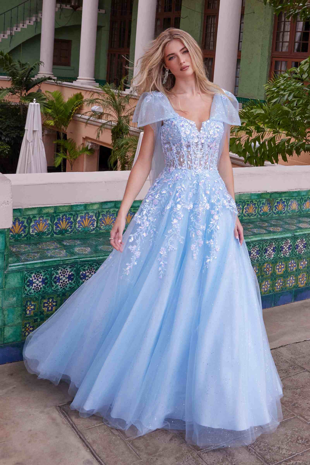 Light blue tulle dress with sequined bodice, short flutter sleeves, and full skirt