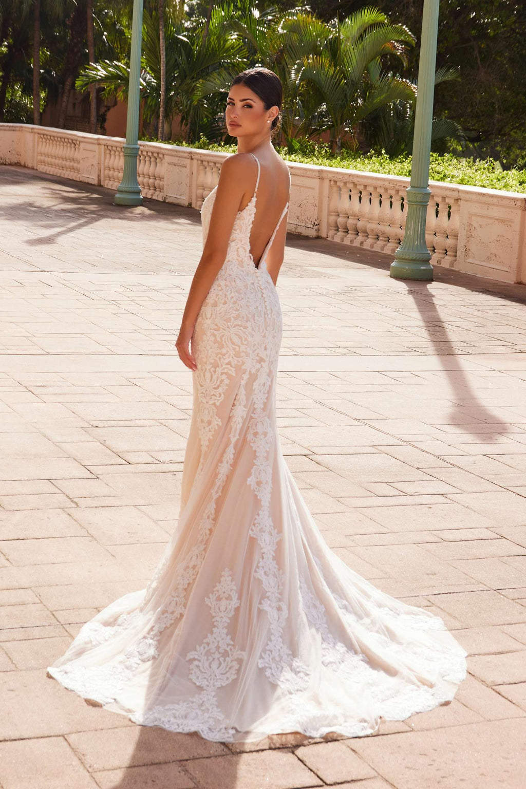 Spaghetti-strap V-neck lace wedding gown with fitted silhouette and flowing flared hem