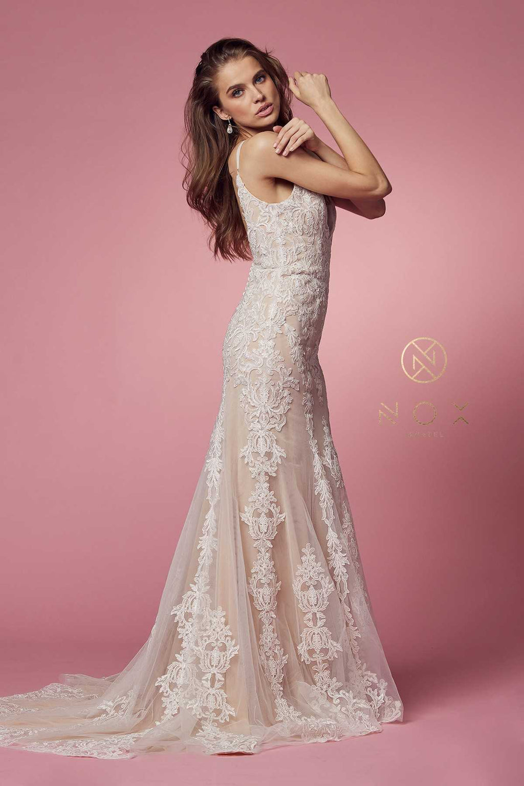 White lace wedding gown with spaghetti straps and V-neck, long fitted silhouette