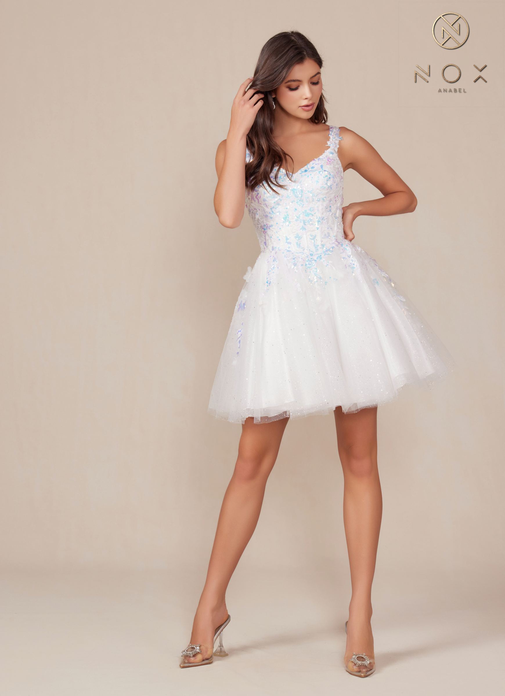 White A-line sequin applique dress with spaghetti straps and short flared tulle skirt