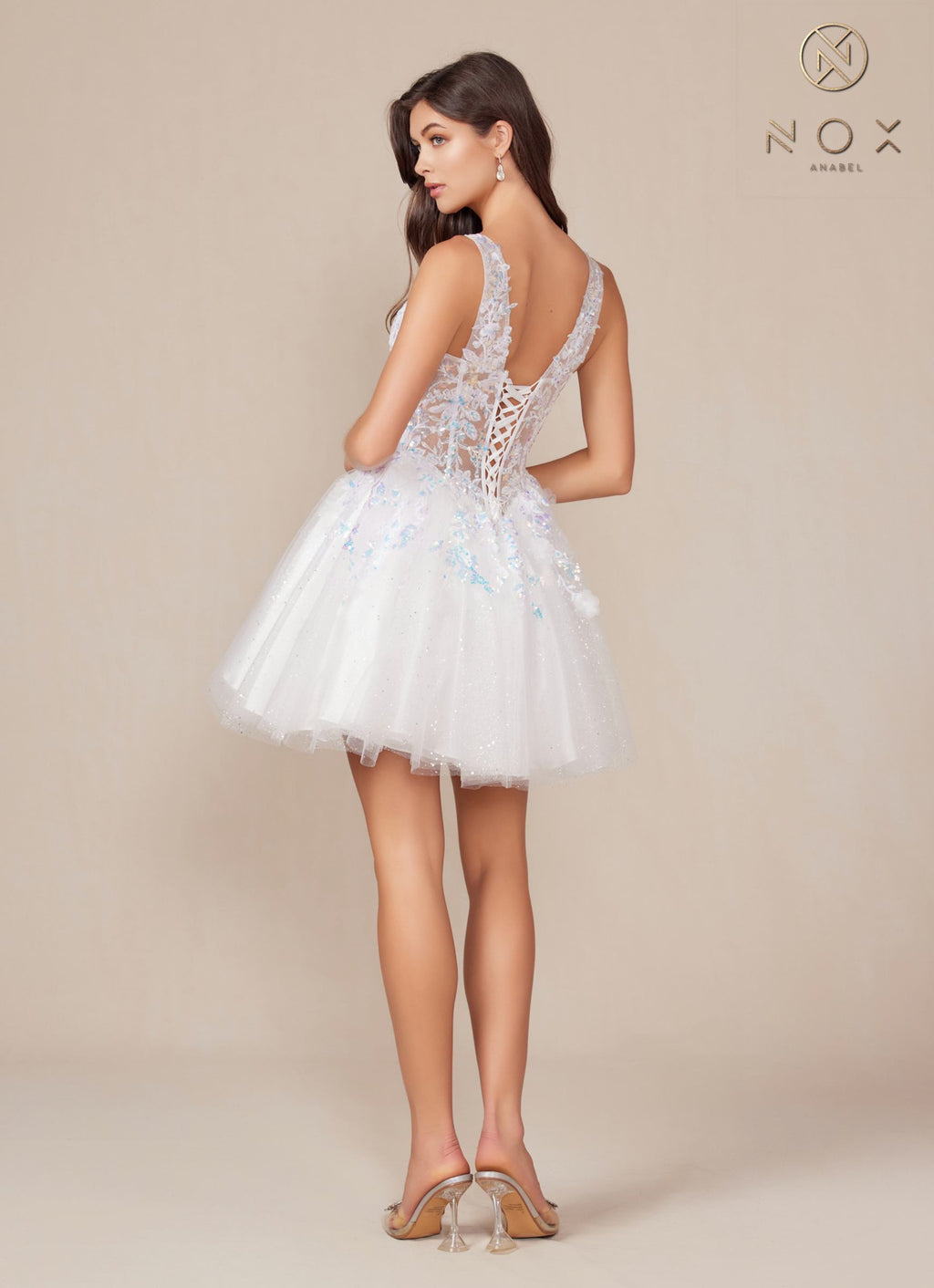 White A-line sequin applique dress with open back and flared tulle skirt