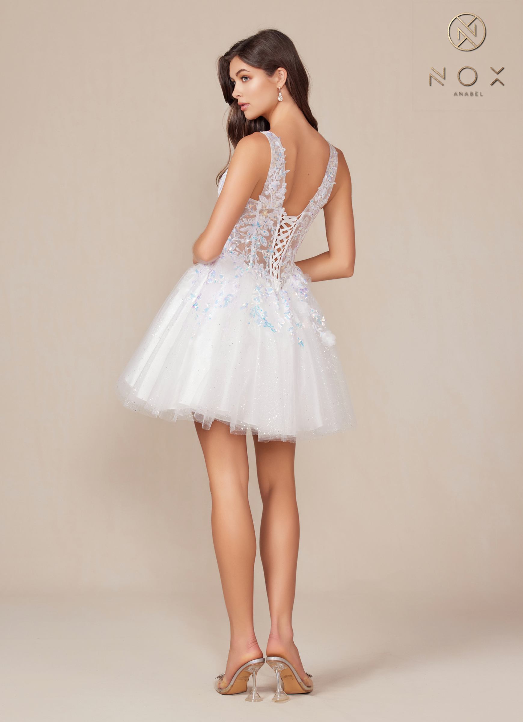 White A-line sequin applique dress with open back and flared tulle skirt