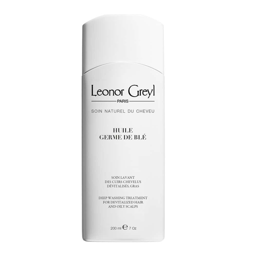 Leonor Greyl hair oil bottle, white cylindrical bottle with label