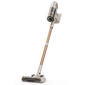 Cordless stick vacuum with silver motor head and rose-gold tube, floor brush attached