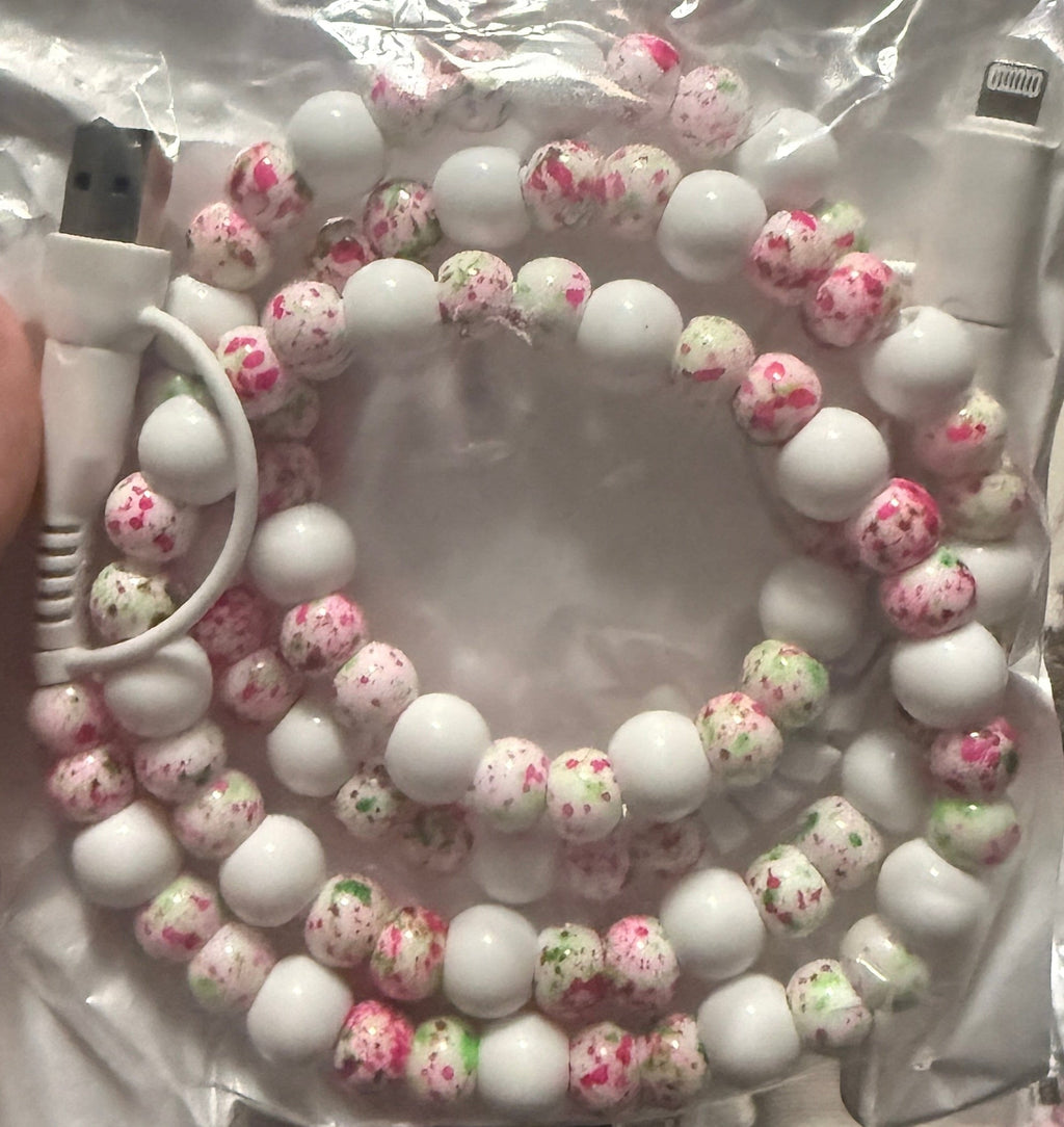 Beaded 4-in-1 charging cable with white beads and pink floral speckled beads, cable ends shown
