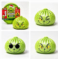 Green character squishy stress ball with friendly face, round shape.