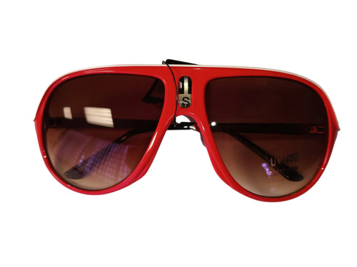 Red oversized 80s-style sunglasses with dark tinted lenses and metal bridge detail