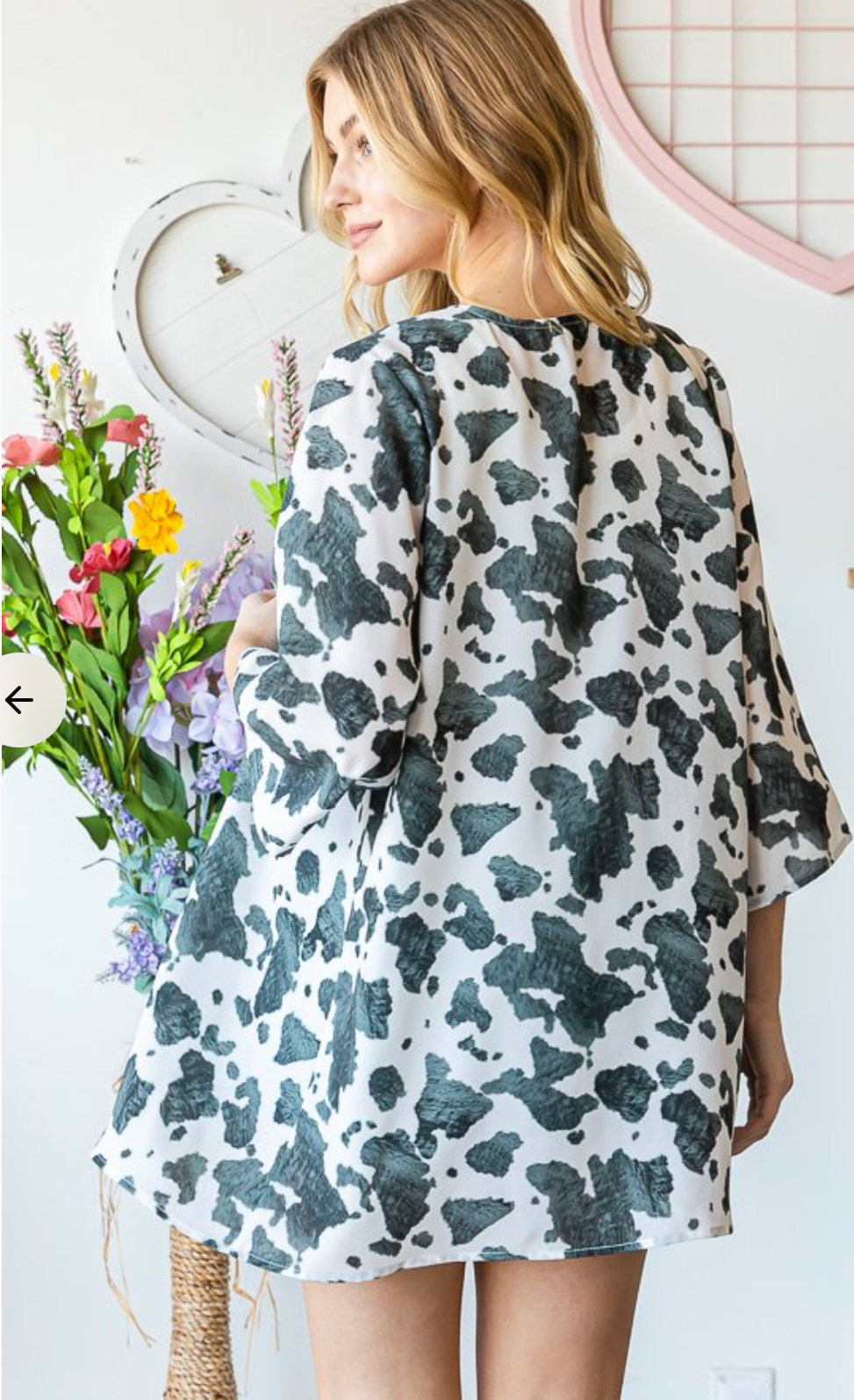 Cow print 3/4 sleeve cardigan shown from back, open front and mid hem