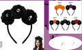 Black fabric headband with large rosette flowers and a small skull detail
