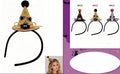 Orange witch hat headband with black band and pointed mini hat decorations