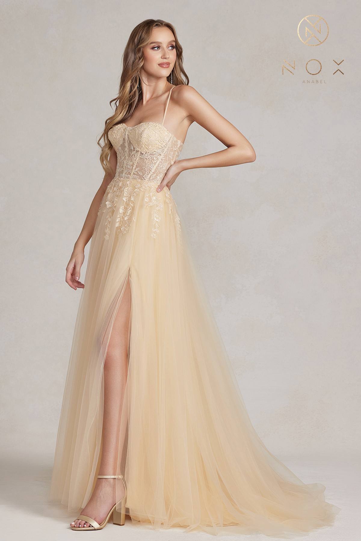 Champagne A-line tulle gown with beaded sweetheart bodice and front slit