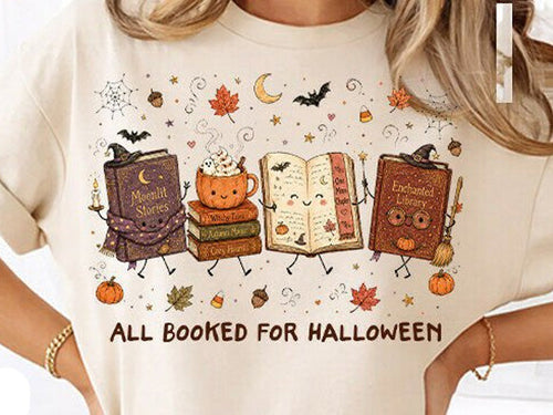 Halloween graphic tee with books, pumpkins, and "All Booked for Halloween" text