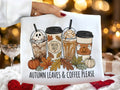 Black graphic T-shirt with autumn leaves and coffee cups print, crew neck