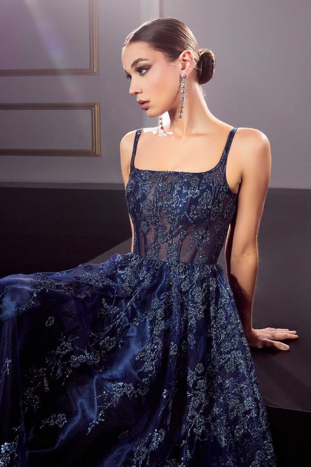 Dark blue glitter A-line gown with corset bodice and spaghetti straps, side view