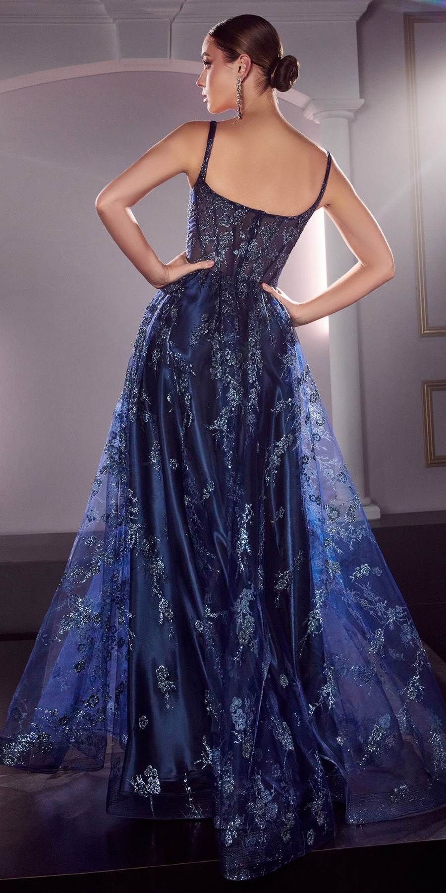 Dark blue glitter A-line gown with corset bodice and spaghetti straps, back view