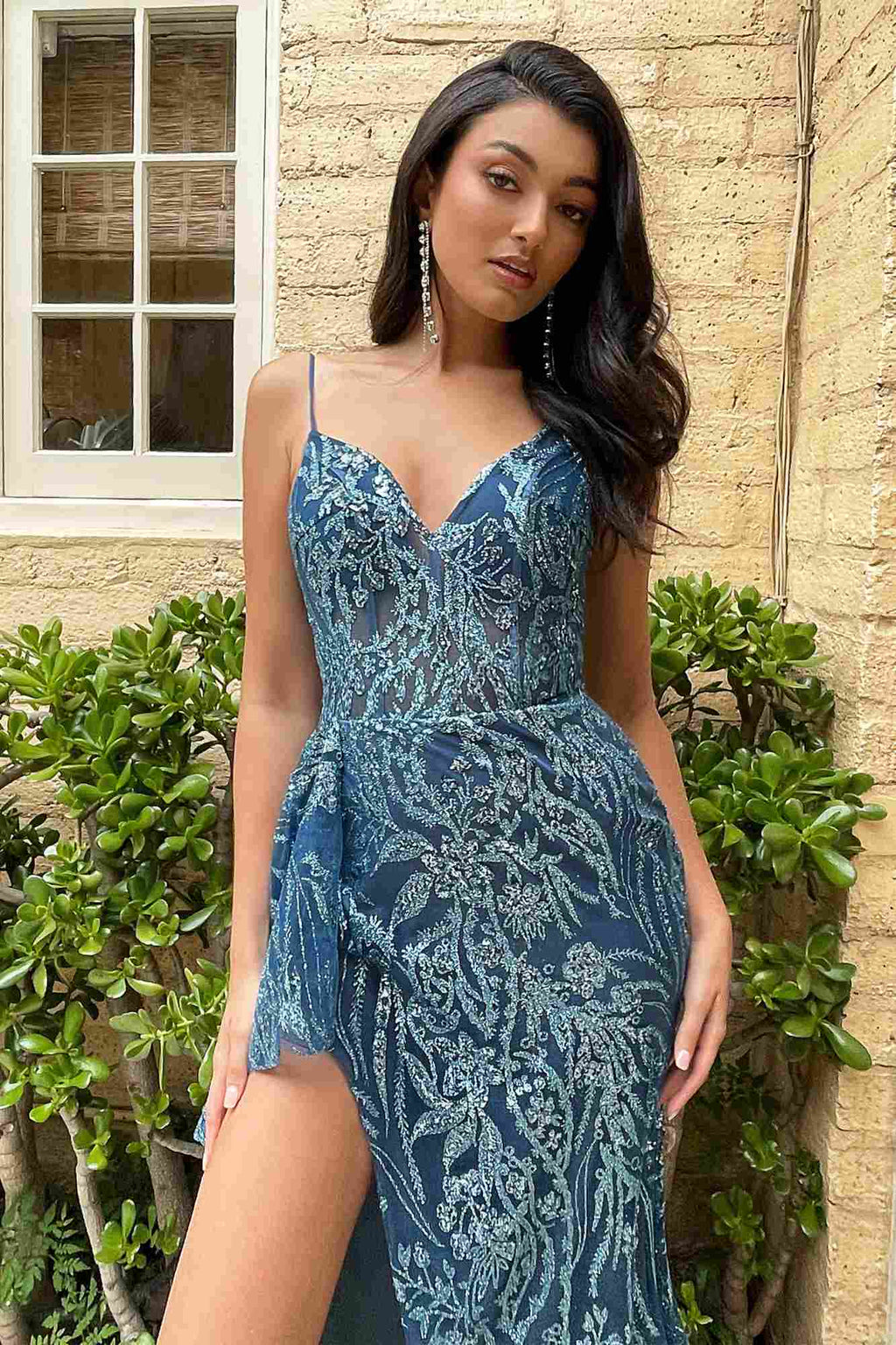 Blue glitter print V-neck gown with thin straps, fitted waist, and front slit