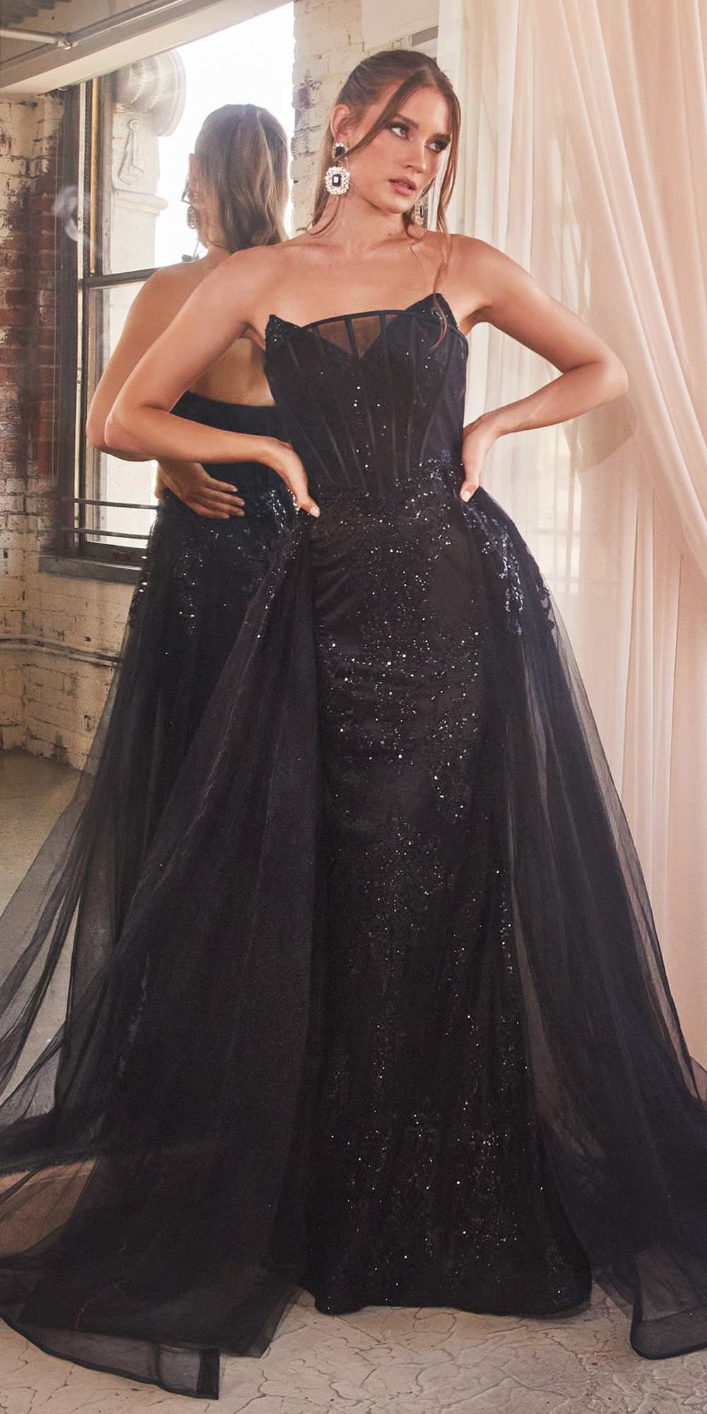Black strapless glitter mermaid gown with long tulle train overlay