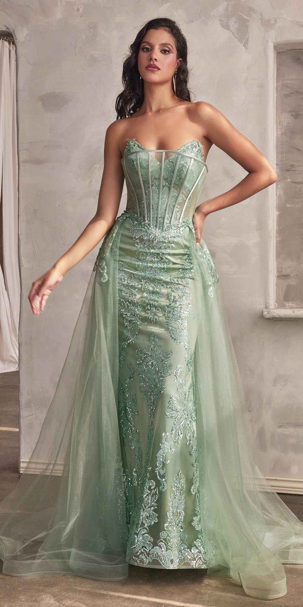 Green strapless glitter mermaid gown with sheer tulle overlay skirt
