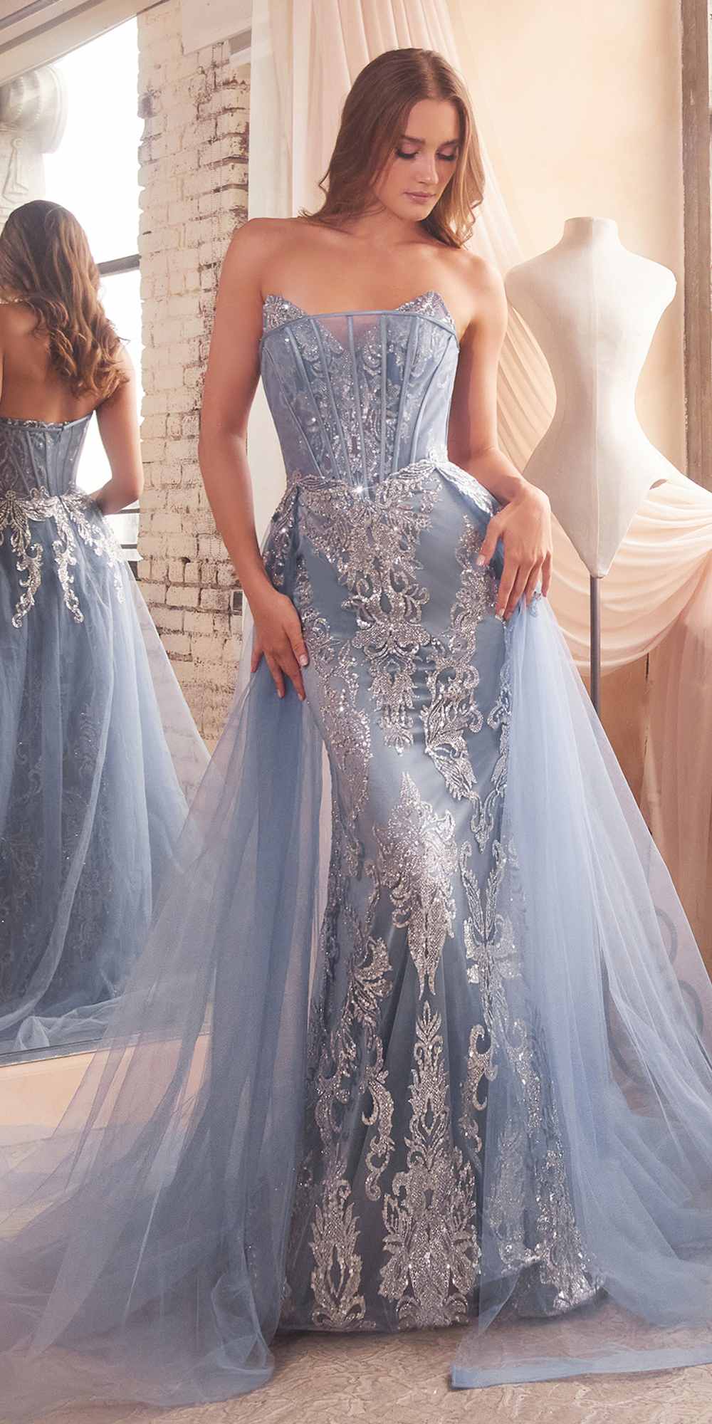 Dusty blue strapless mermaid gown with embroidered glitter detail and airy tulle overlay