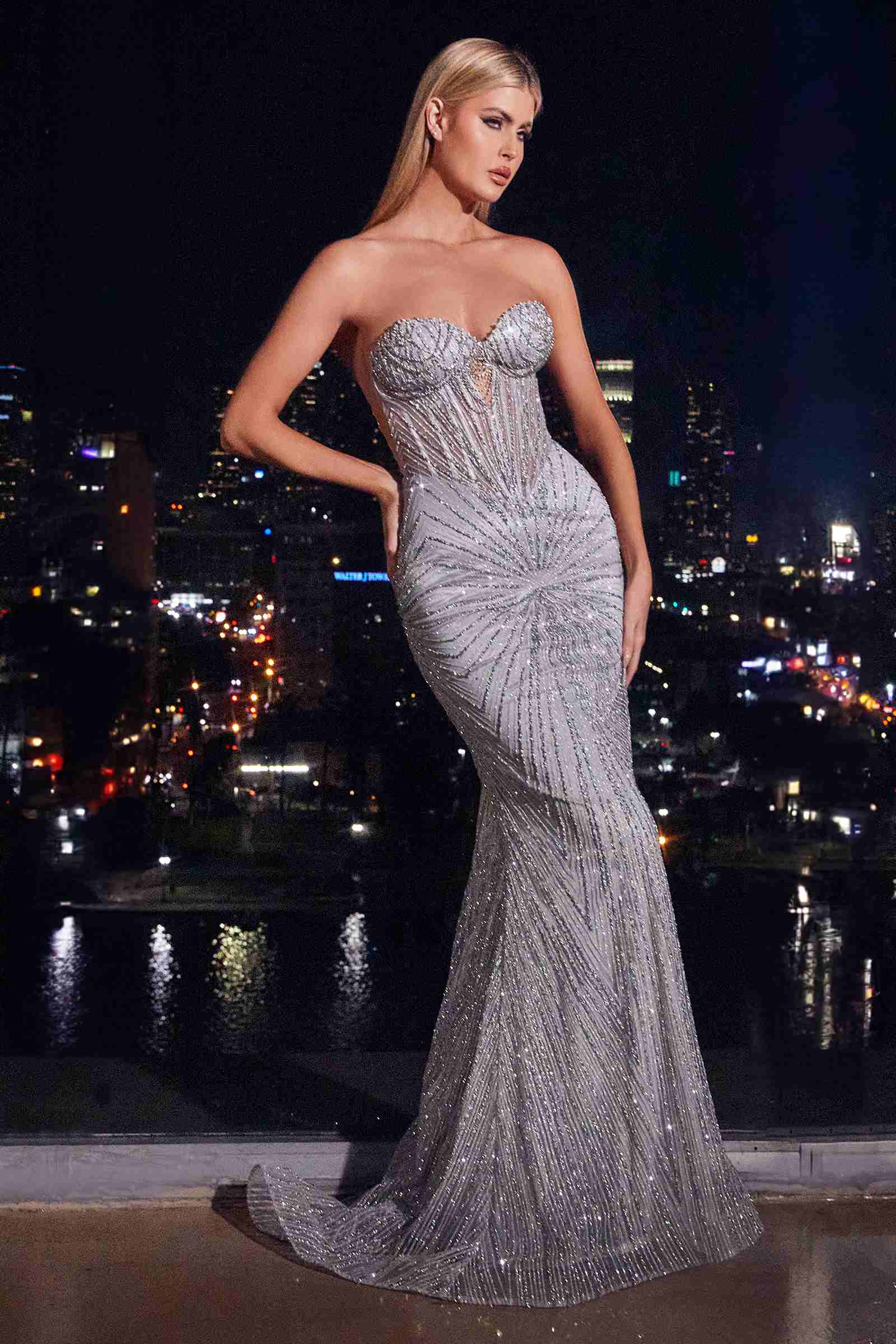 Metallic sequin strapless fitted long gown with sweetheart neckline and mermaid-style skirt.
