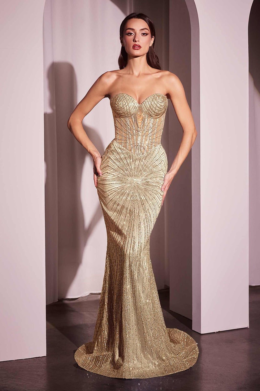 Gold strapless fitted long gown with sweetheart neckline and ruched bodice